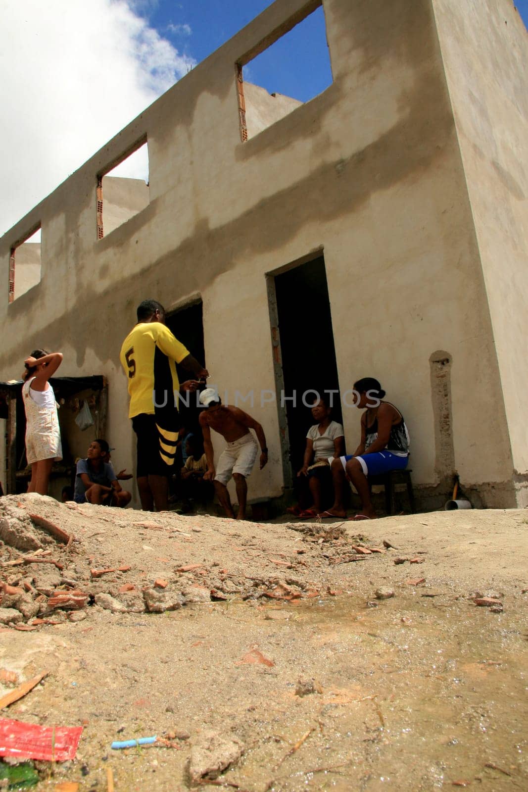 eunapolis, bahia / brazil - january 15, 2009: people who are members of the Association Residents Without a Roof are seen during the invasion of houses under construction, aimed at poor families in the city of Eunapolis....