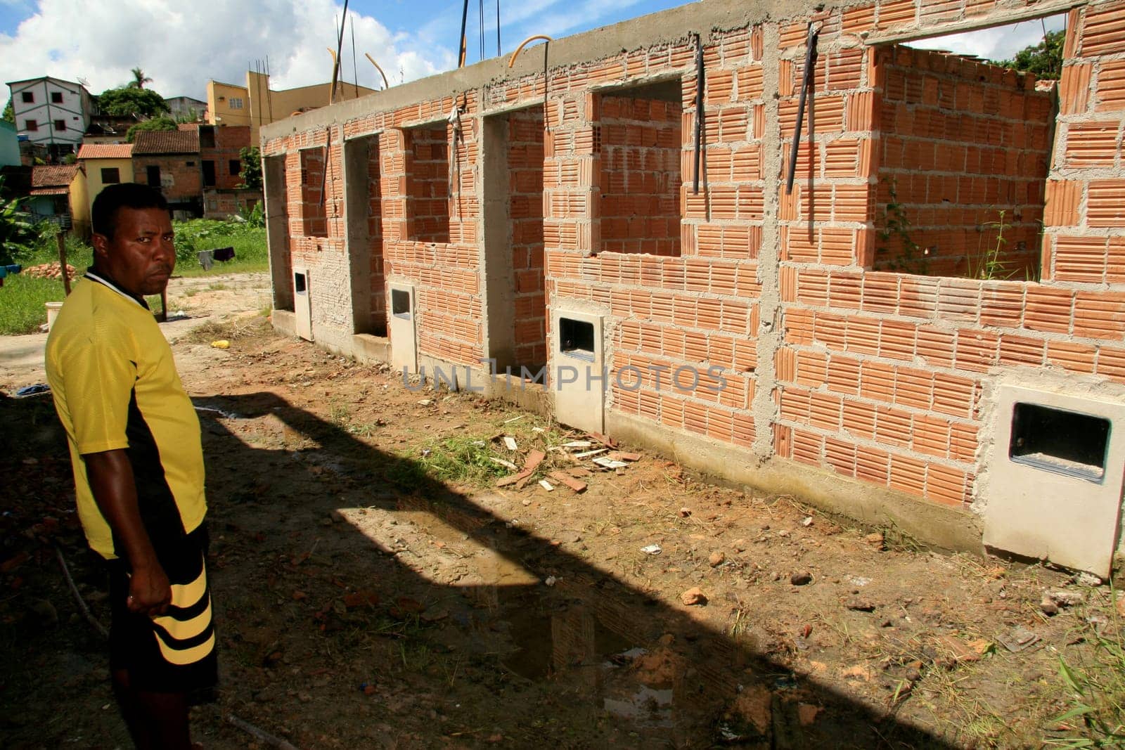 eunapolis, bahia / brazil - january 15, 2009: people who are members of the Association Residents Without a Roof are seen during the invasion of houses under construction, aimed at poor families in the city of Eunapolis....