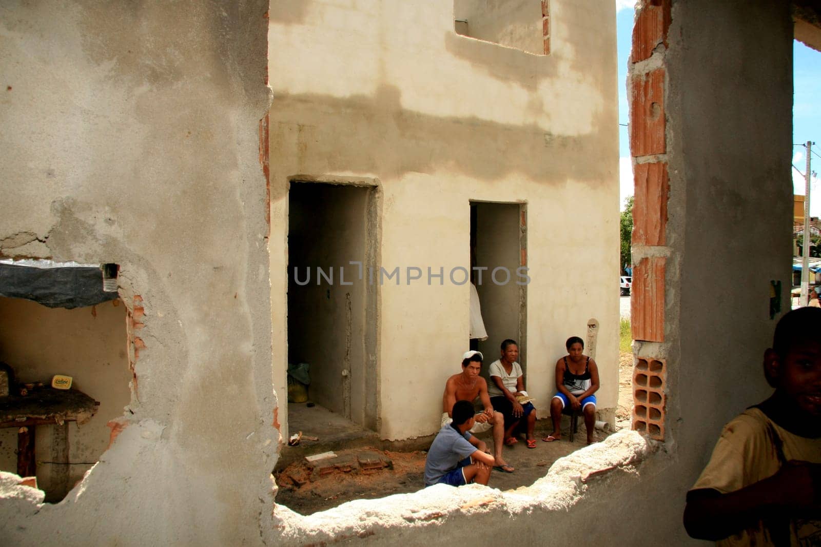eunapolis, bahia / brazil - january 15, 2009: people who are members of the Association Residents Without a Roof are seen during the invasion of houses under construction, aimed at poor families in the city of Eunapolis....