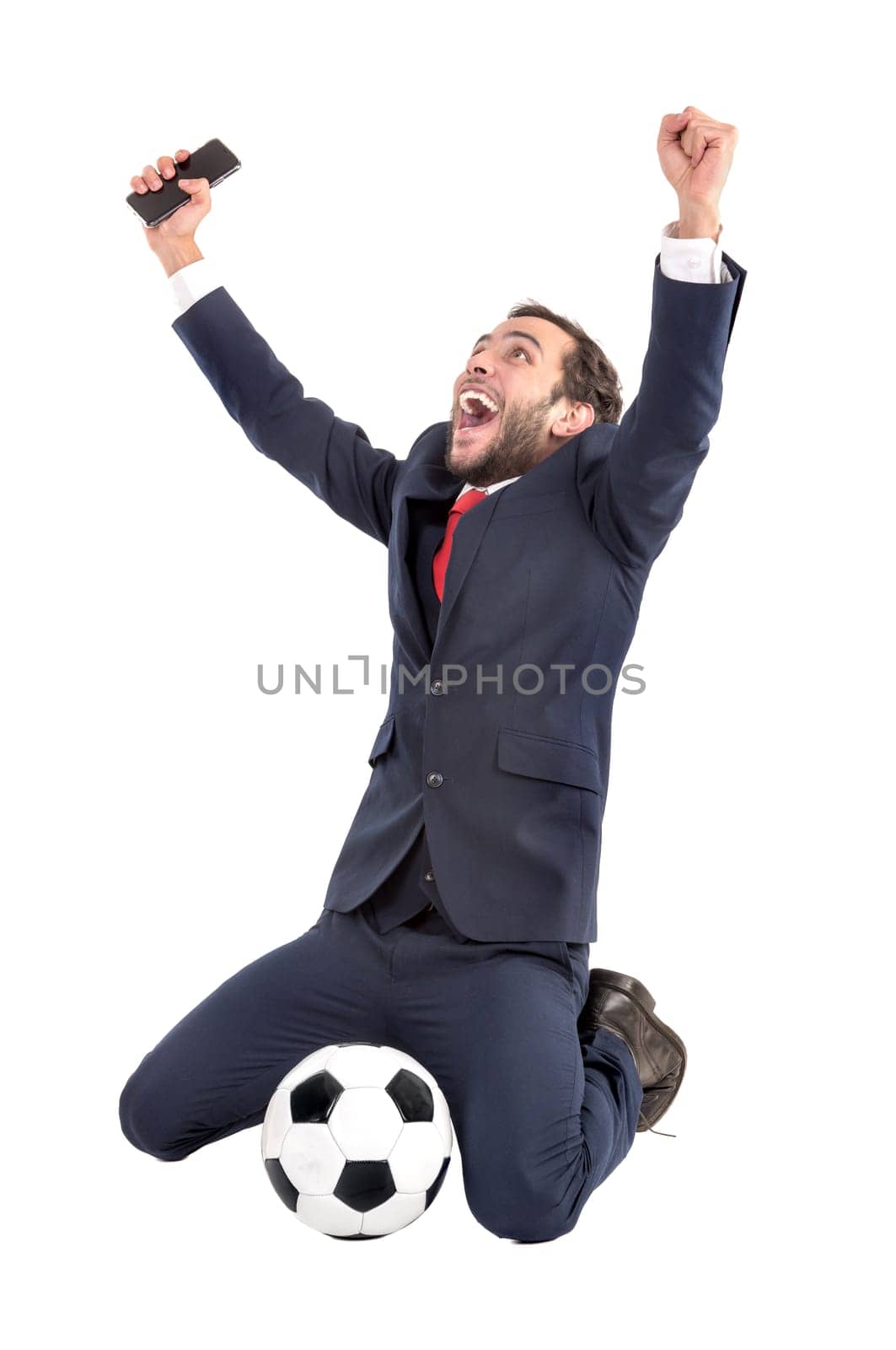 Businessman with soccer ball celebrating isolated in white