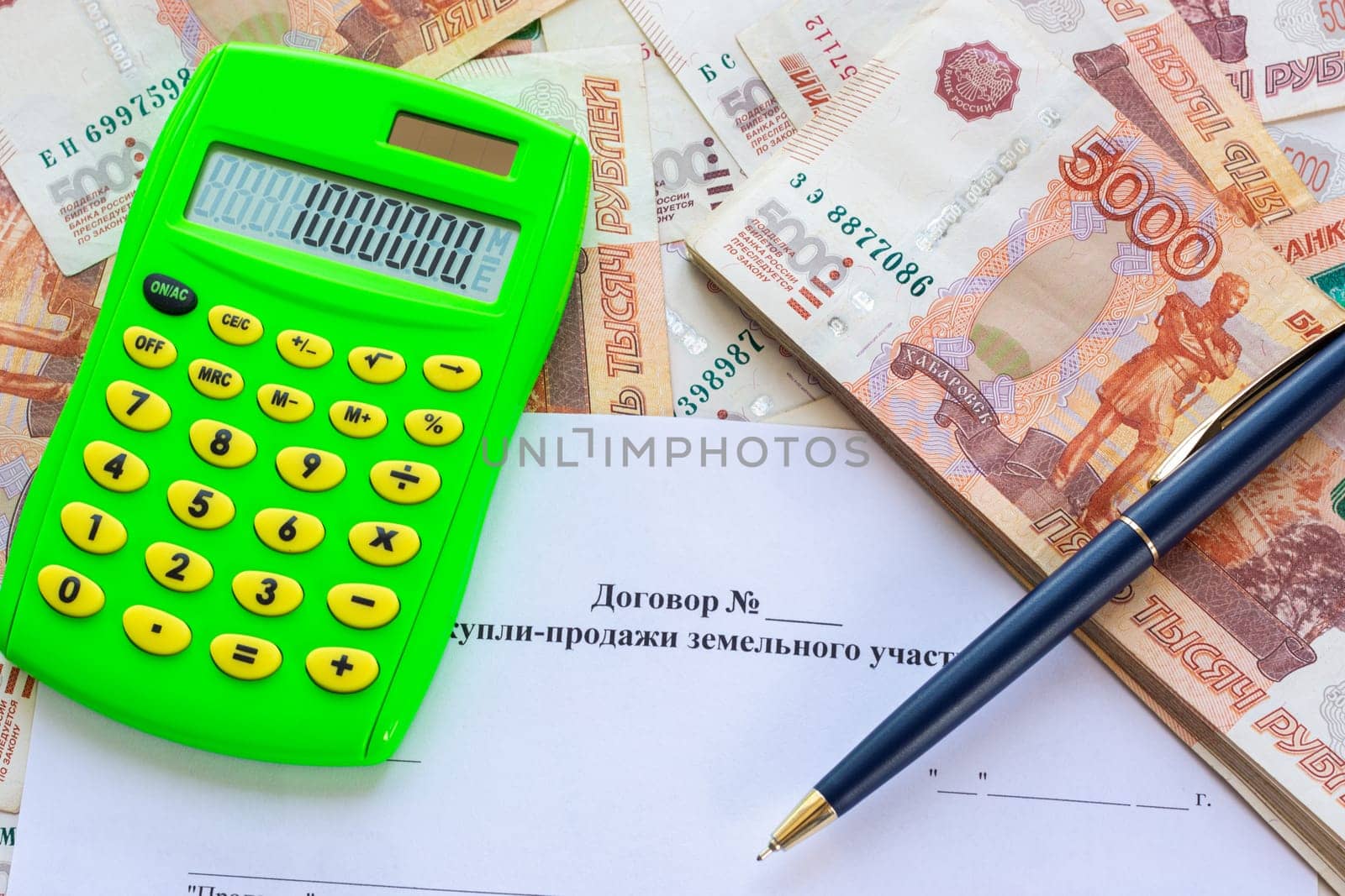 The contract for the sale of the land plot contains a calculator with the number 1,000,000, a bundle of money and a pen