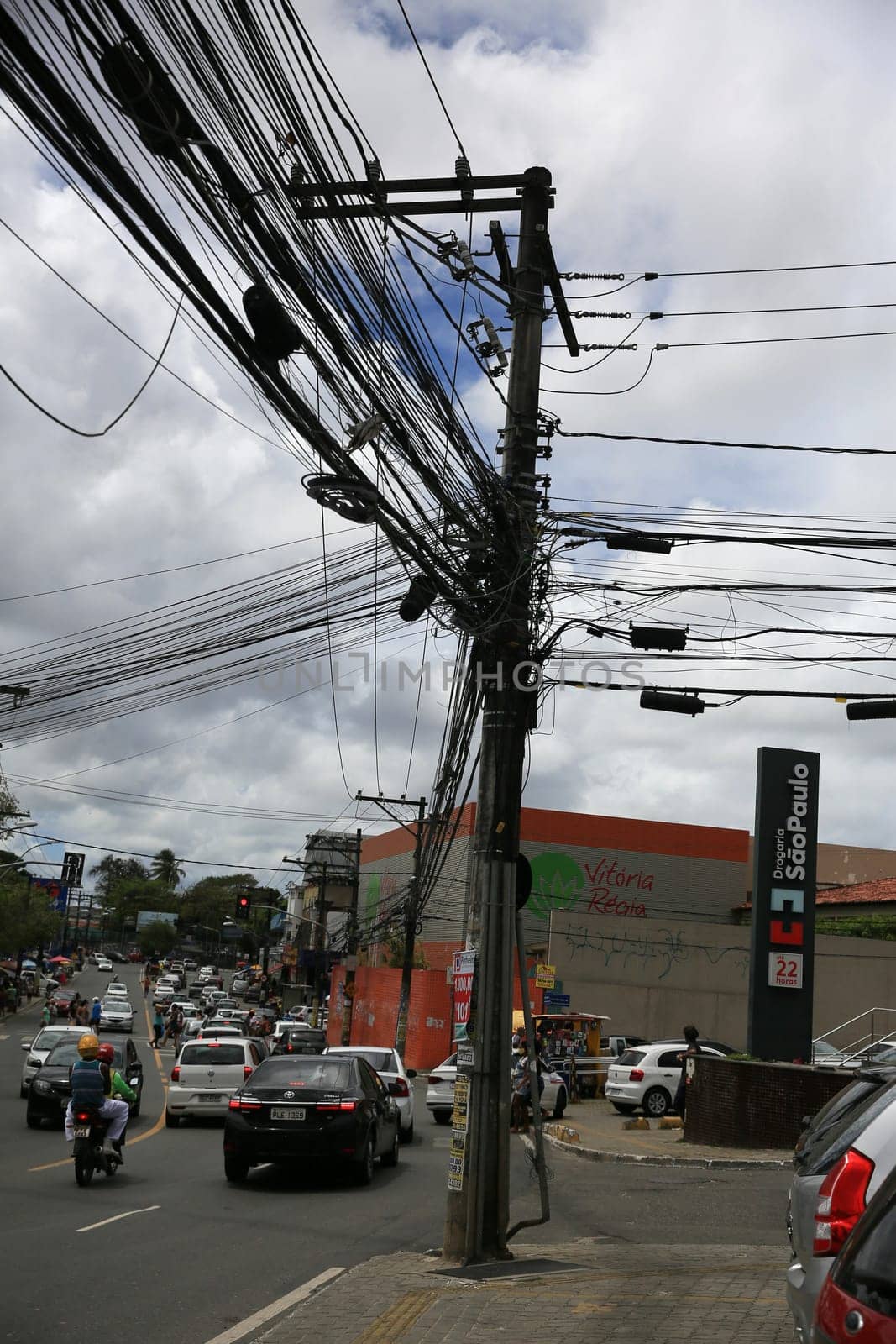 salvador, bahia / brazil - september 11, 2020: Post loaded with wires in the power grid in the neighborhood of Cabula in the city of Salvador..