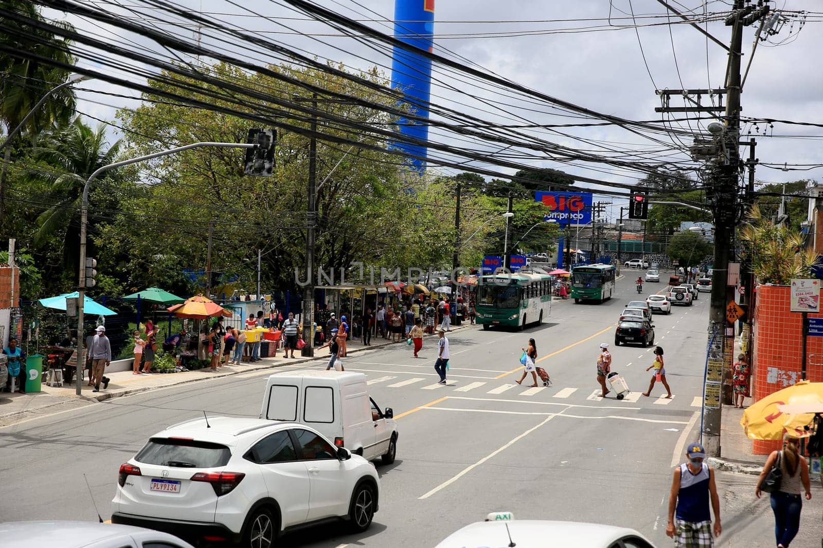 salvador, bahia / brazil - september 11, 2020: people and vehicles are seen on a street in the neighborhood of Cabula in the city of Salvador.