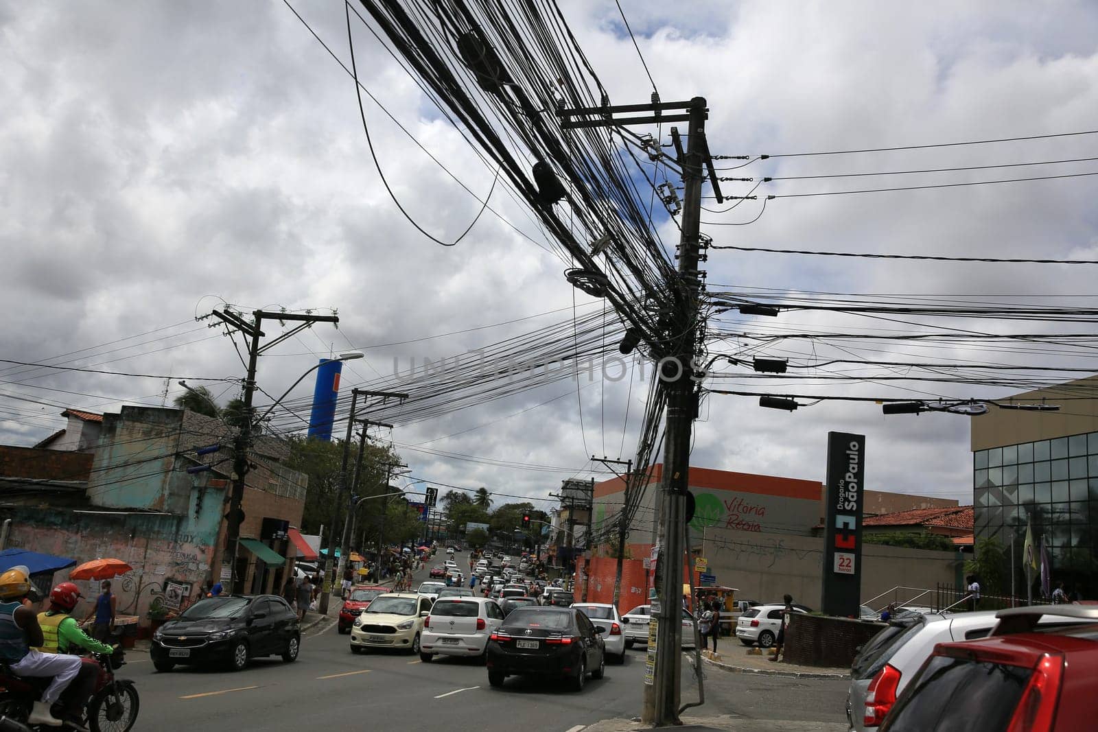 salvador, bahia / brazil - september 11, 2020: Post loaded with wires in the power grid in the neighborhood of Cabula in the city of Salvador..
