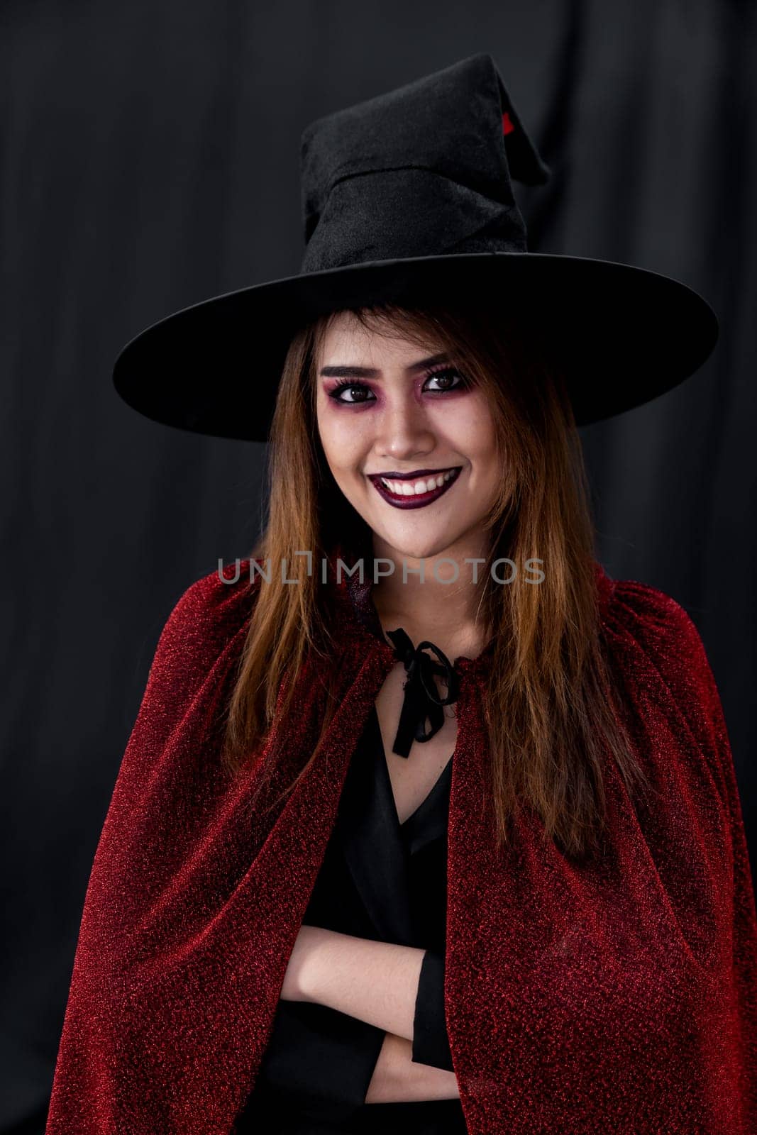 Portrait of asian young adult teenage woman wear Halloween costume cloth for Halloween party carnival. Halloween celebrate and international holiday concept.