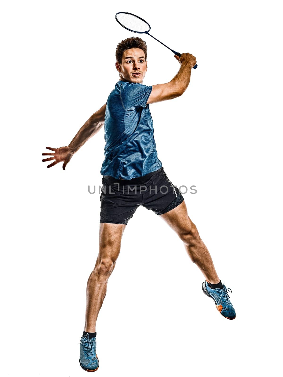 one caucasian young Badminton player man in studio isolated on white background