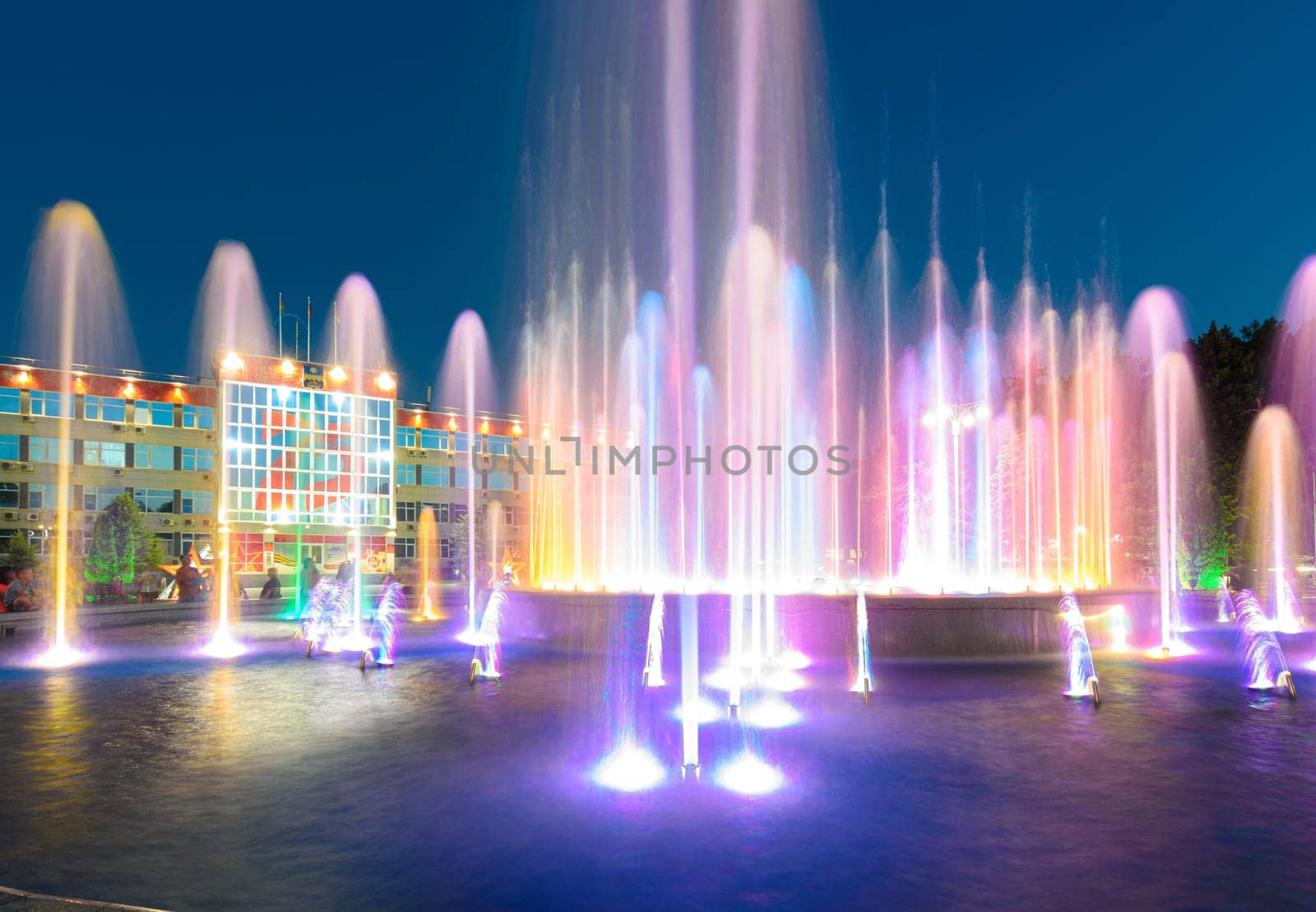 Anapa, Russia - July 17, 2020: Many vertically directed jets of the fountain in front of the city administration building of the Anapa resort