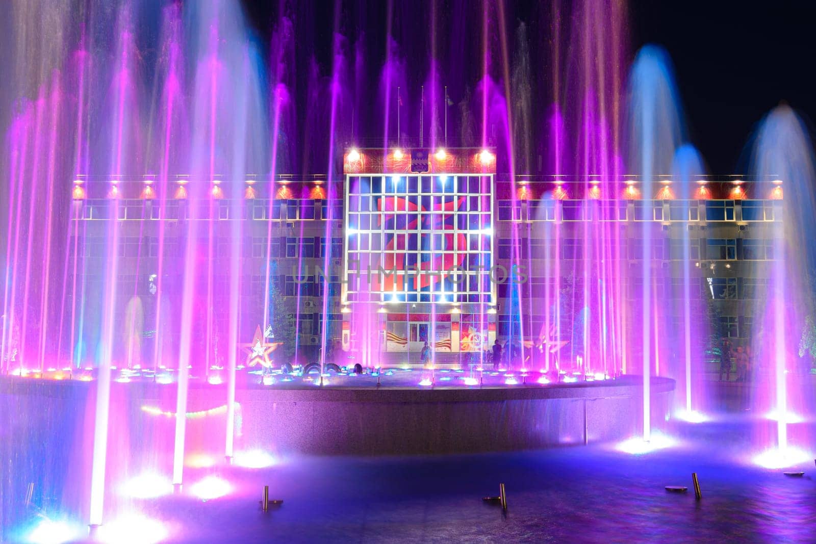 Anapa, Russia - July 17, 2020: View of the building of the administration of the city of the resort of Anapa through the nearby fountain