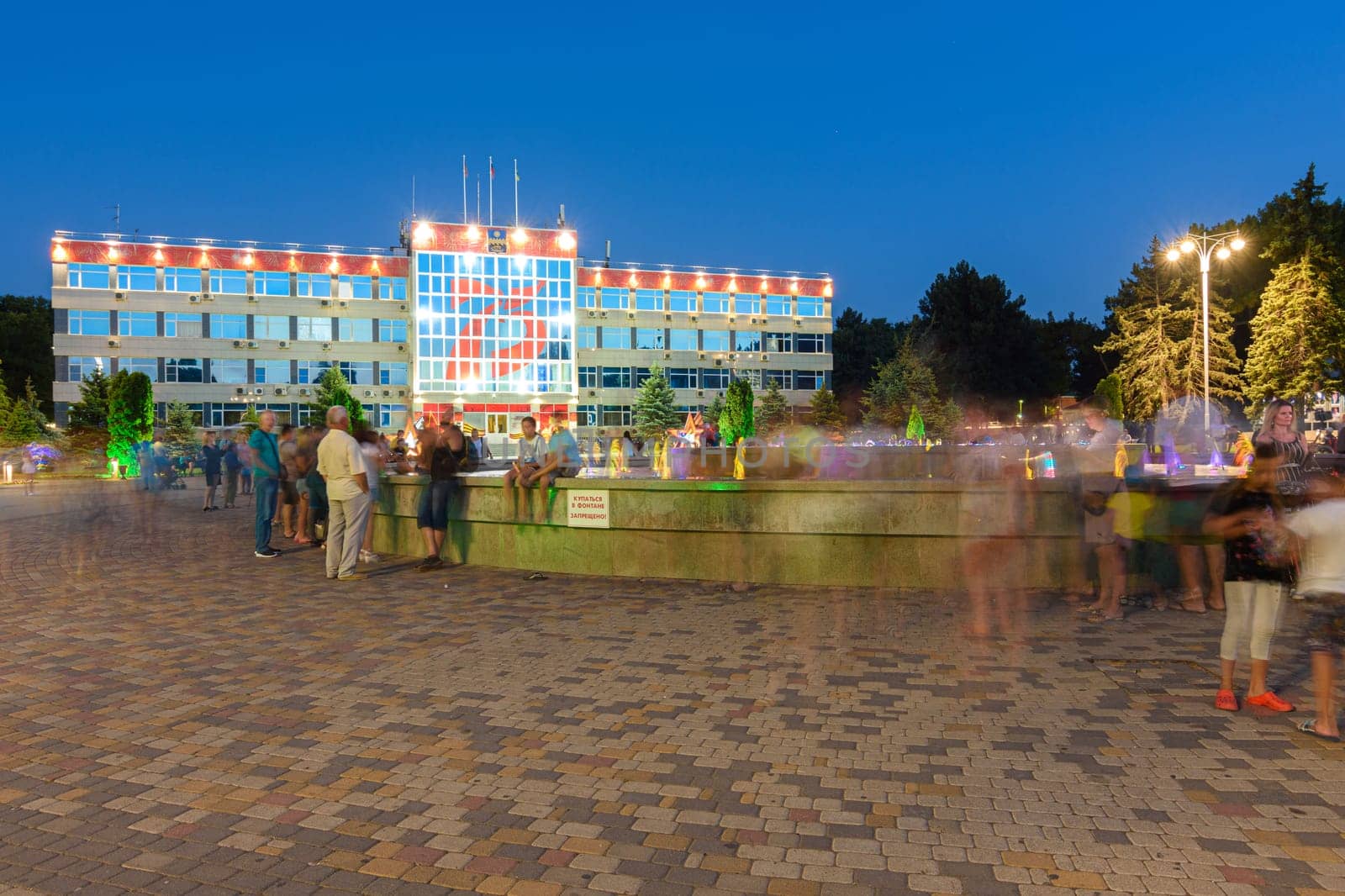 Anapa, Russia - July 17, 2020: A crowd of tourists on one of the main attractions of the city of the resort of Anapa, Soviets Square in front of the city administration