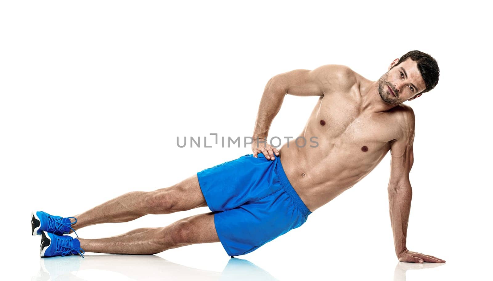 one caucasian man exercising fitness exercises isolated on white background