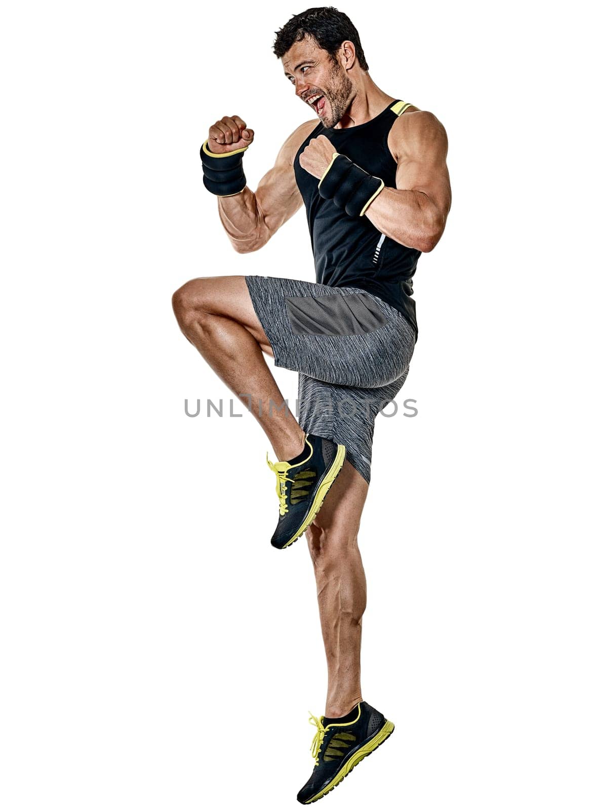 one caucasian fitness man exercising cardio boxing exercises in studio isolated on white background