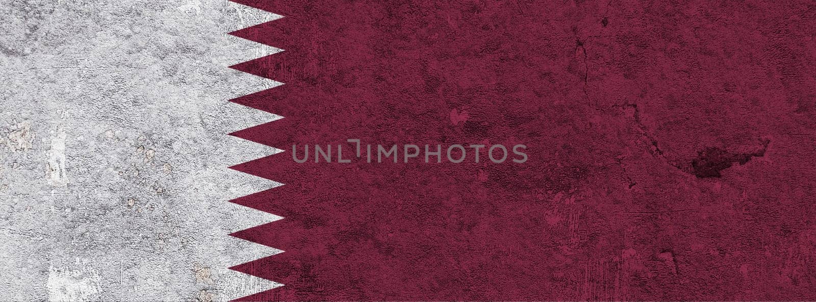 Flag of Qatar on weathered concrete