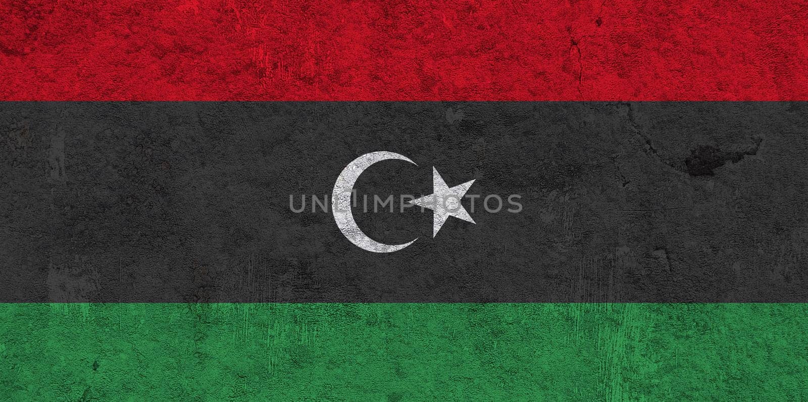 Flag of Libya on weathered concrete