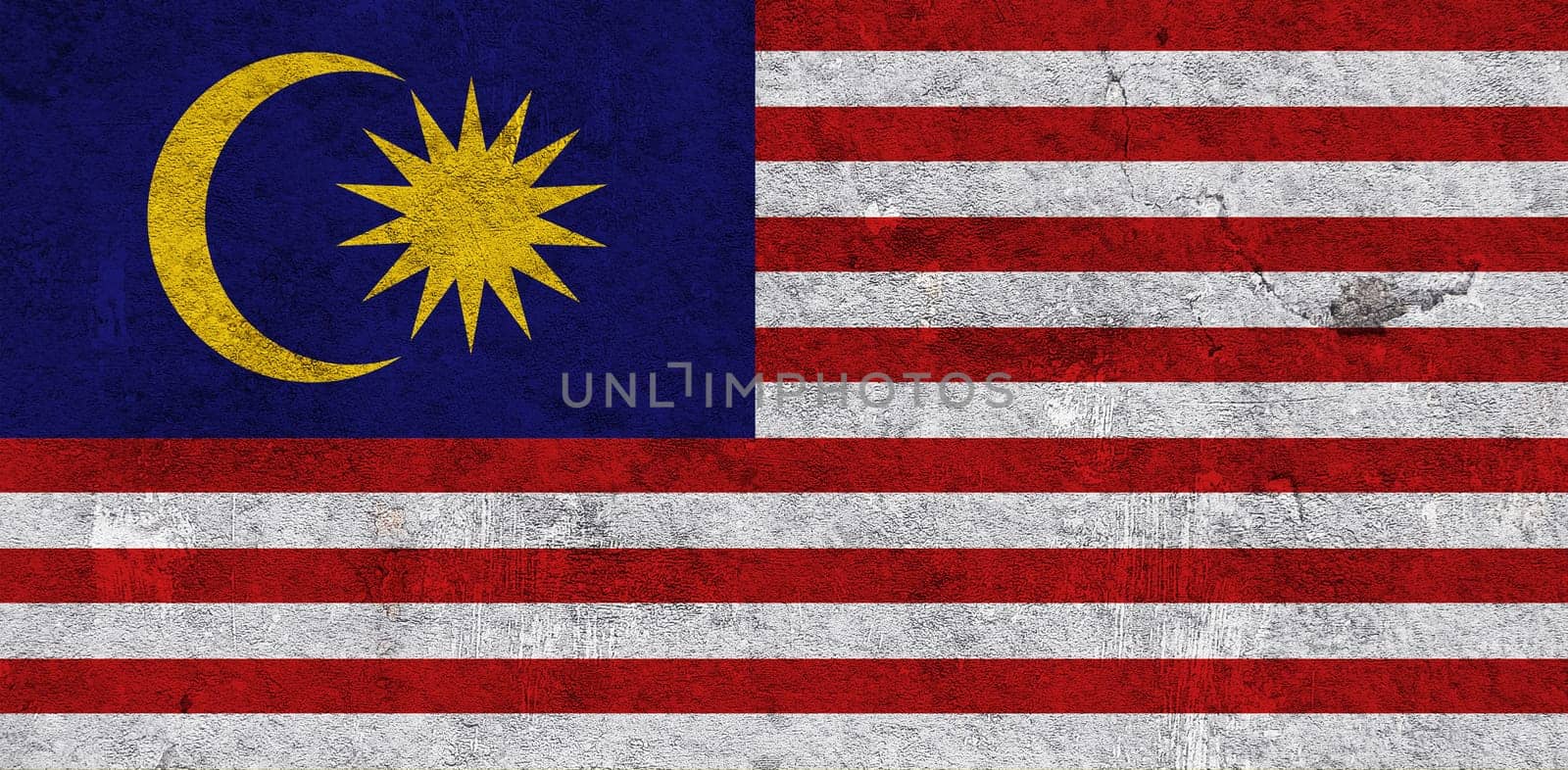 Flag of Malaysia on weathered concrete