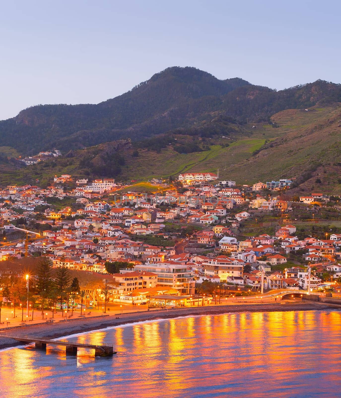 Cityscape of Madeira coast town at twilight. Madeira island, Portugal