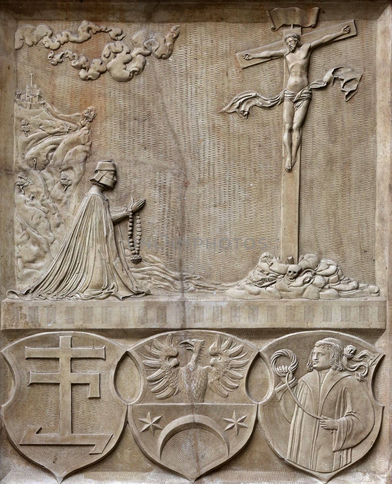 An old crucifixion relief sculpture outside St. Stephen's Cathedral in Vienna, Austria