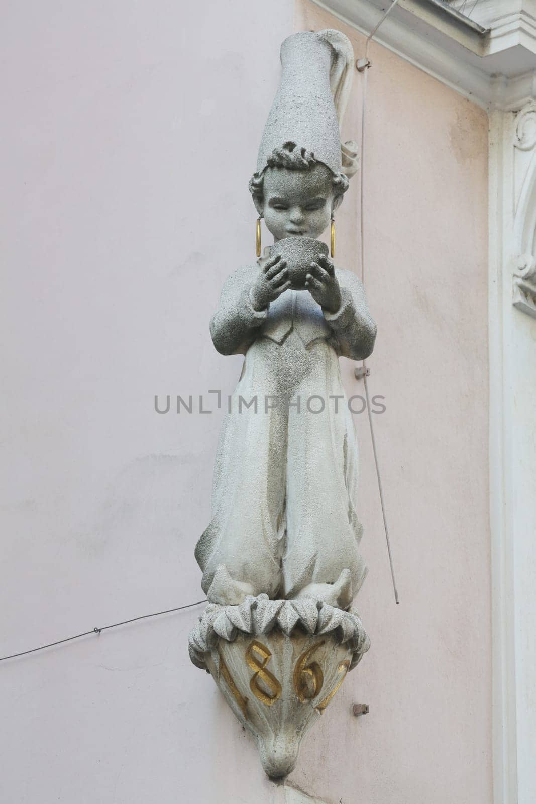Architectural artistic decorations on facade of house in Vienna, Austria