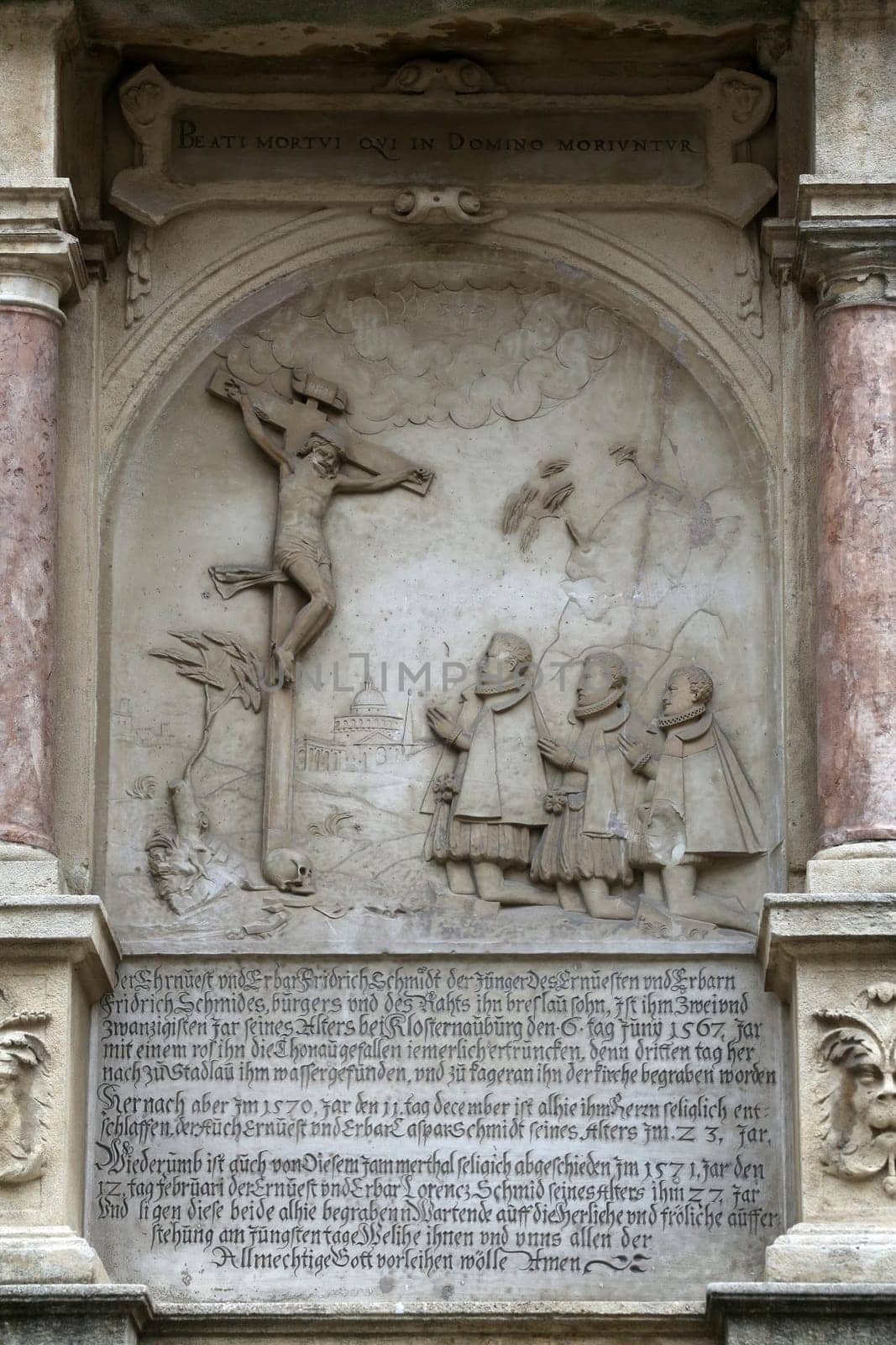 An old crucifixion relief sculpture outside St. Stephen's Cathedral in Vienna, Austria