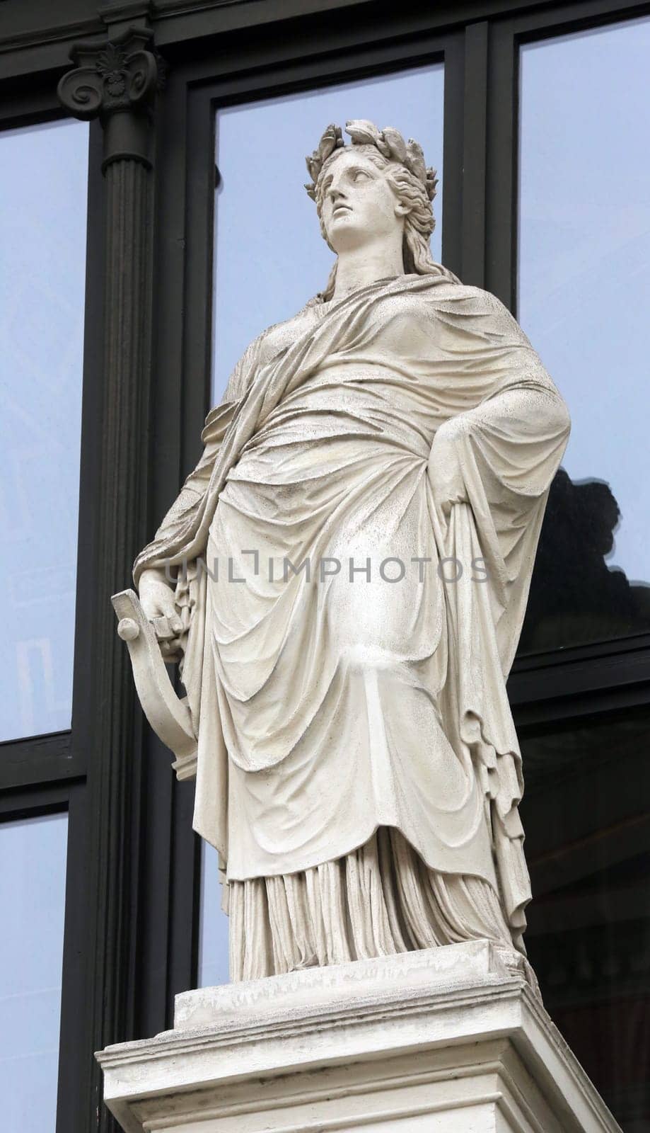Statue on facade of Musikverein in Vienna, Austria