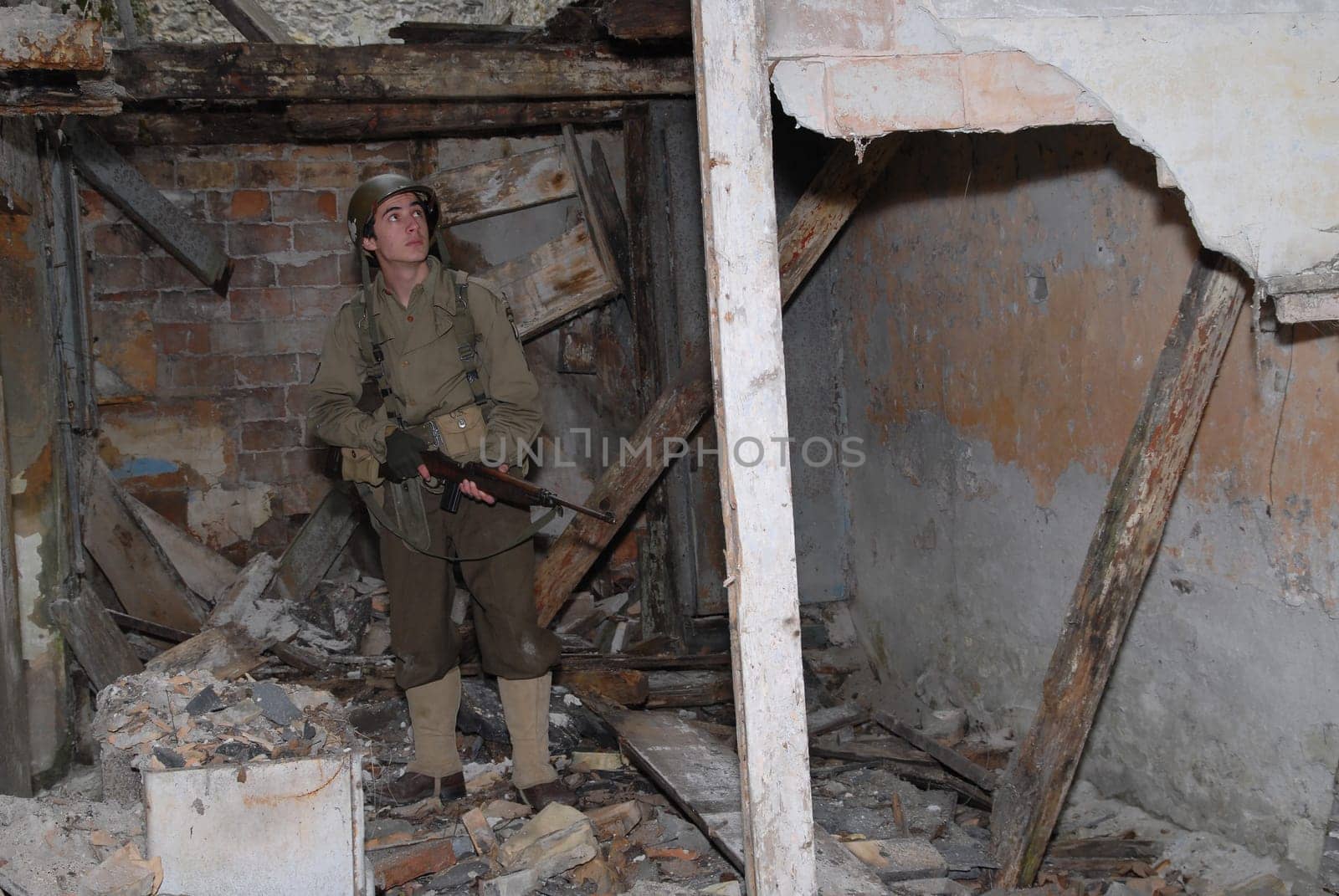 a young American soldier ww2 in the ruins