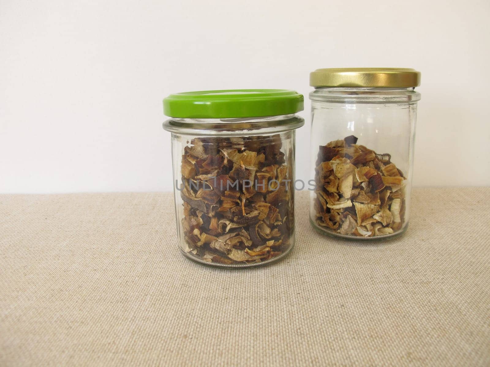 Dried mushrooms in a glass, bay bolete and porcino