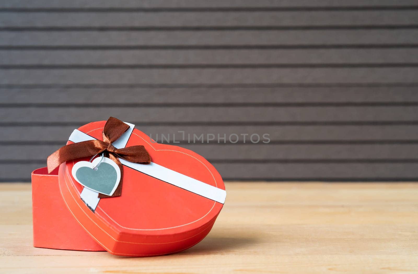 Close up heart-shaped box on wood background,Valentines Day concept with red heart-shaped box