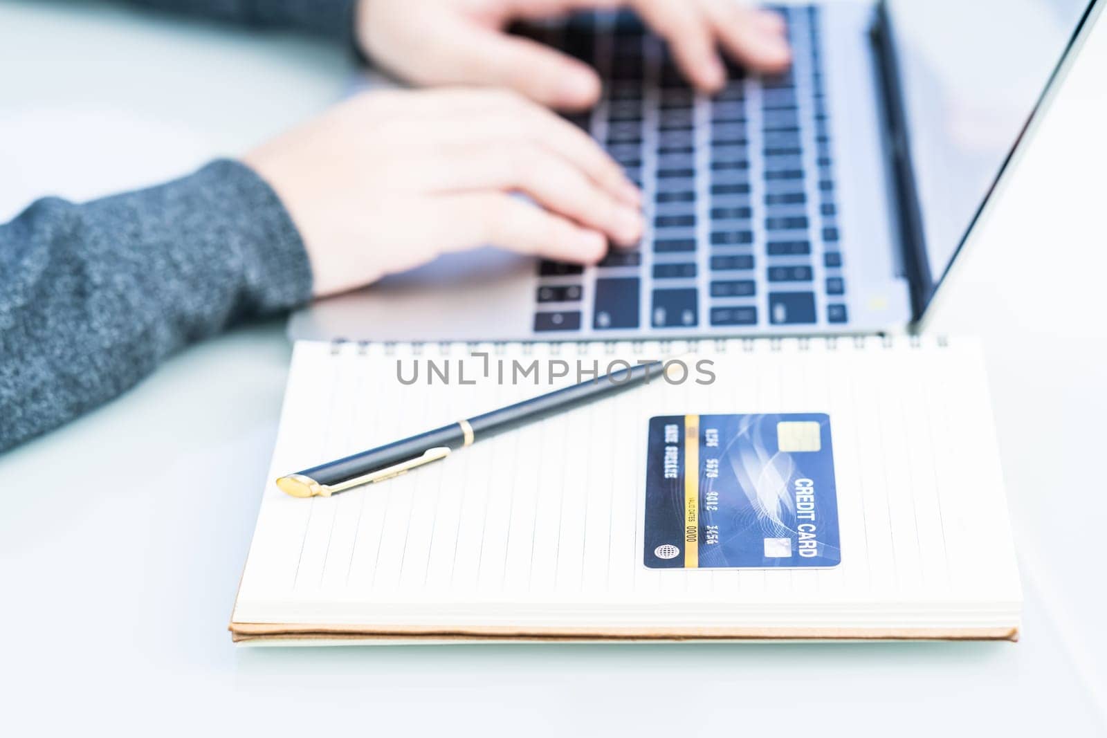 Woman using laptop payment credit card and for online shopping, Close up of female hands making online payment