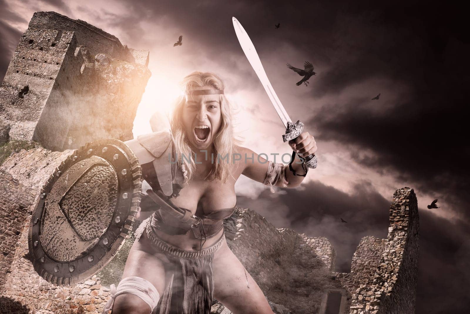 Ancient woman warrior or Gladiator posing with sword and shield