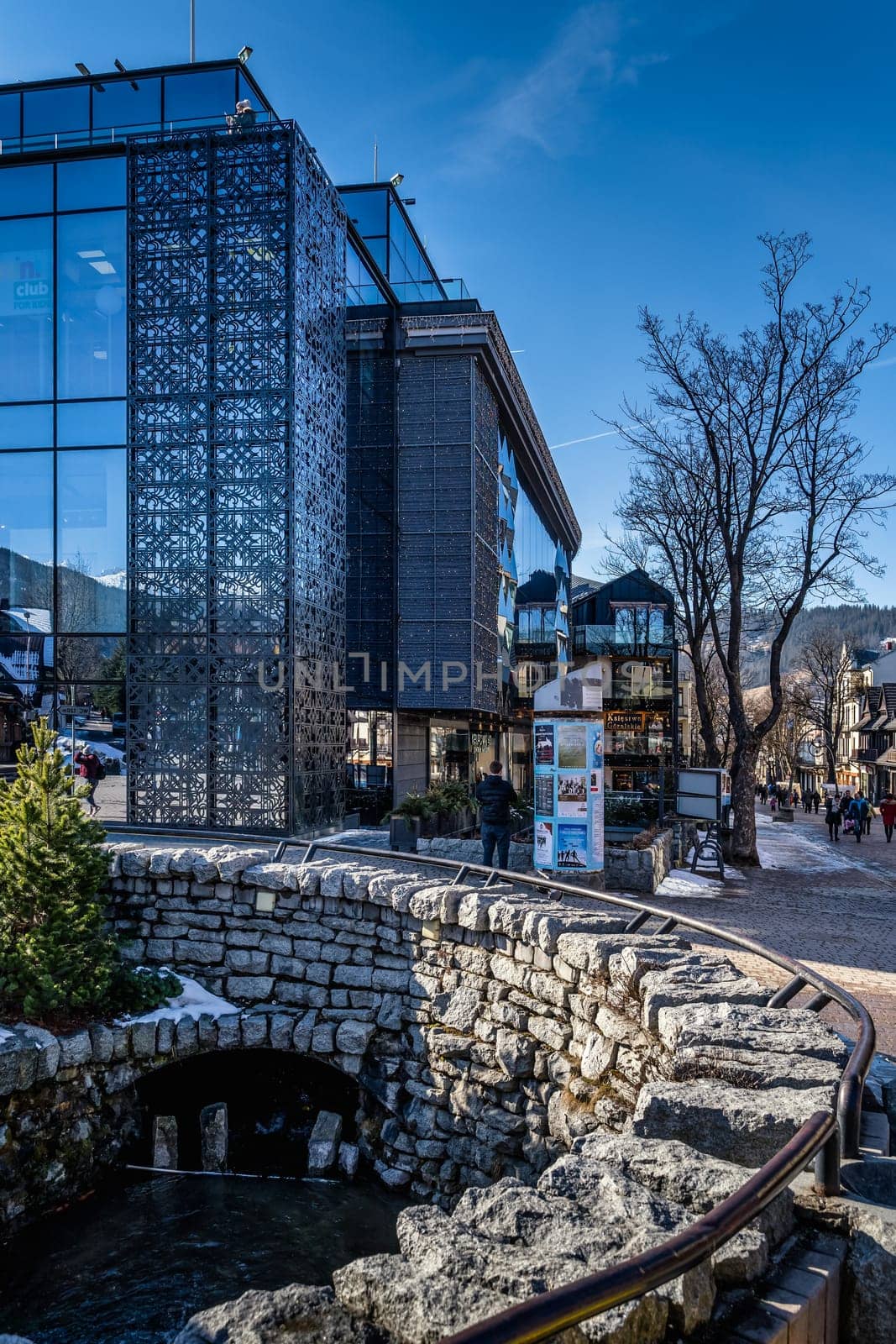 Zakopane, Poland, March 2019 Famous Krupowki promenade, main shopping area in Zakopane. Winter time. Zakopane is called a winter capital of Poland