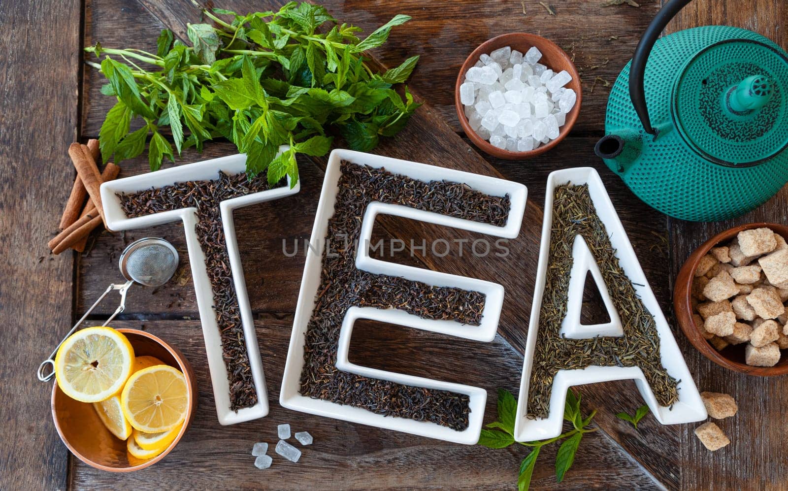 Making delicious tea with fresh mint leaves and sugar cubes