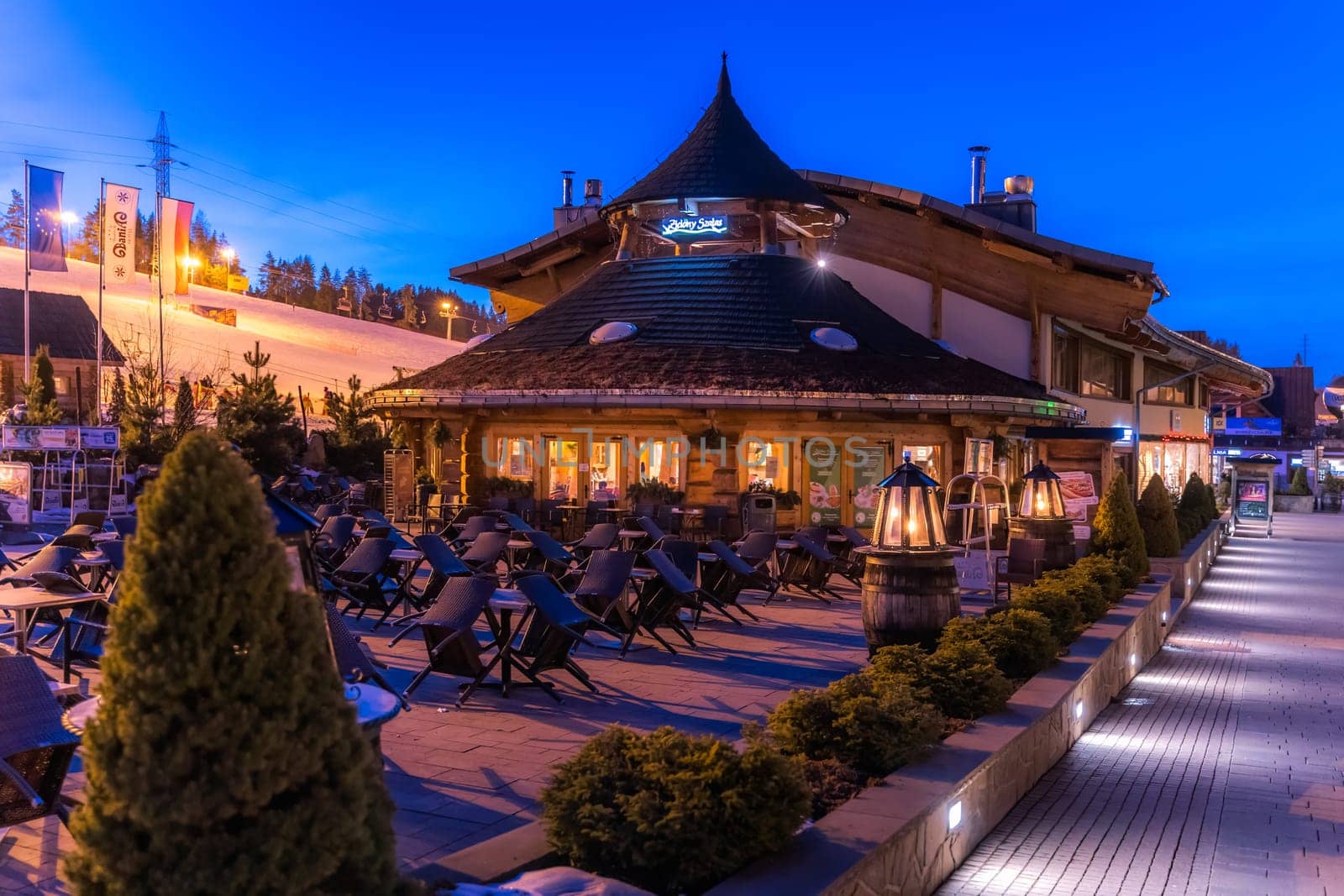 Bialka Tatrzanska, Poland, March 2019 Restaurants and shopping area in ski lift Bania at night time. Popular winter sports village in Tatra Mountains