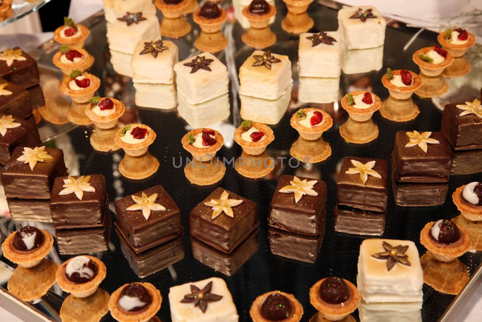 Colorful desserts and pastry served on a wedding party