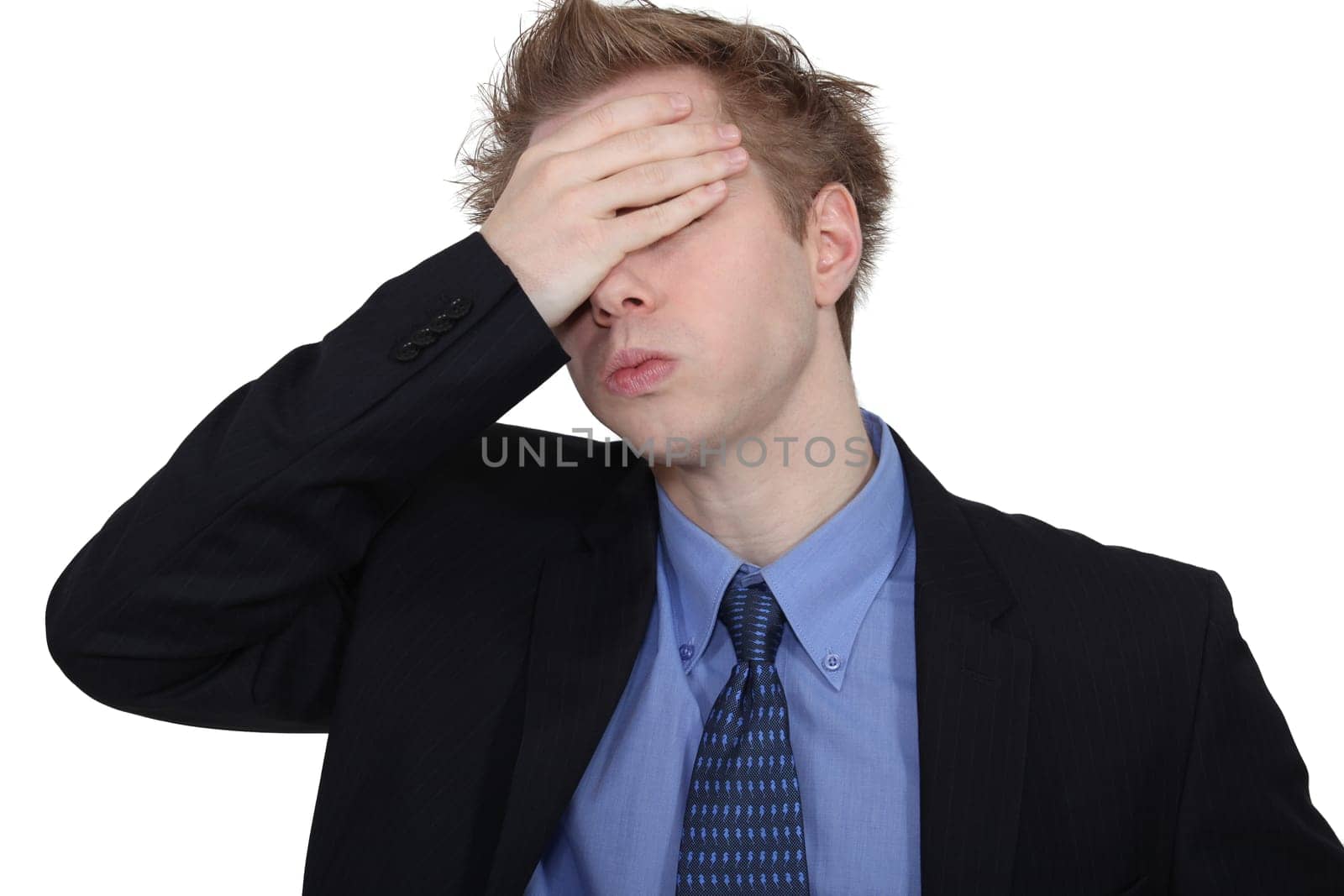 Young woman putting her hands to her head