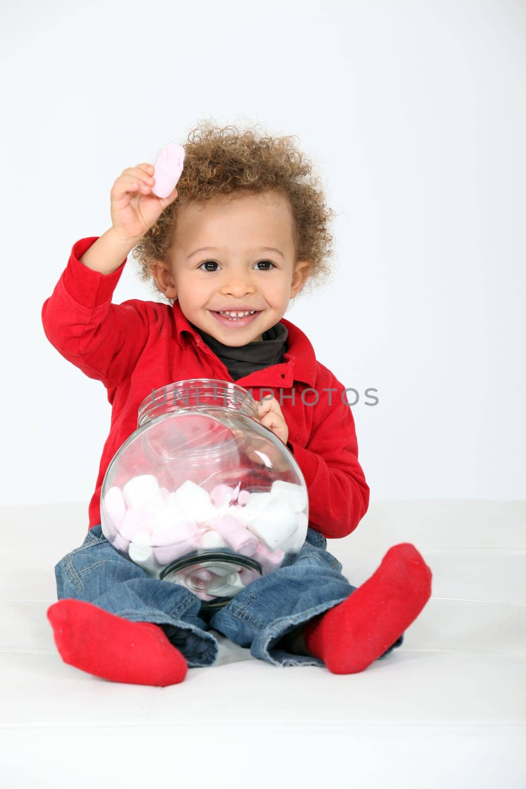 Little boy eating sweets