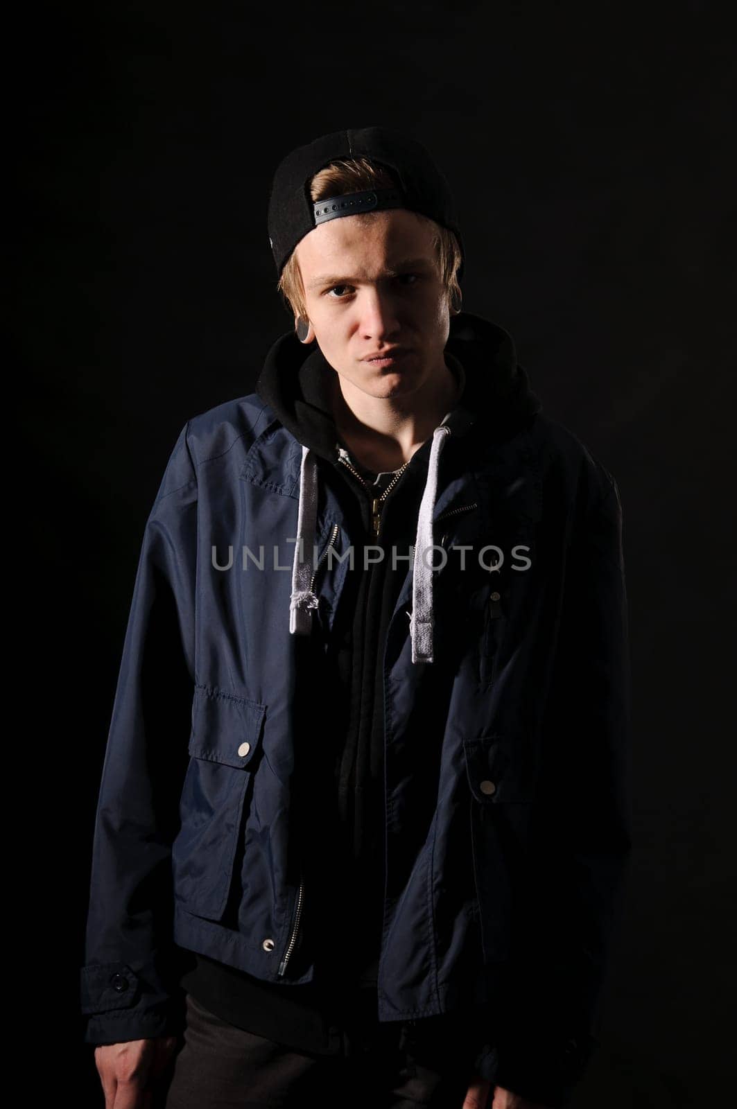 handsome young man on black background