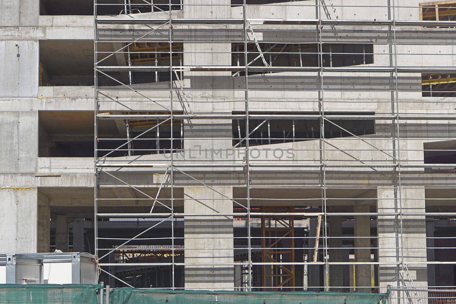 Scaffolding at concrete building construction site