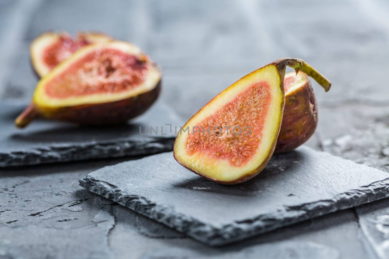 Fresh organic figs on black background
