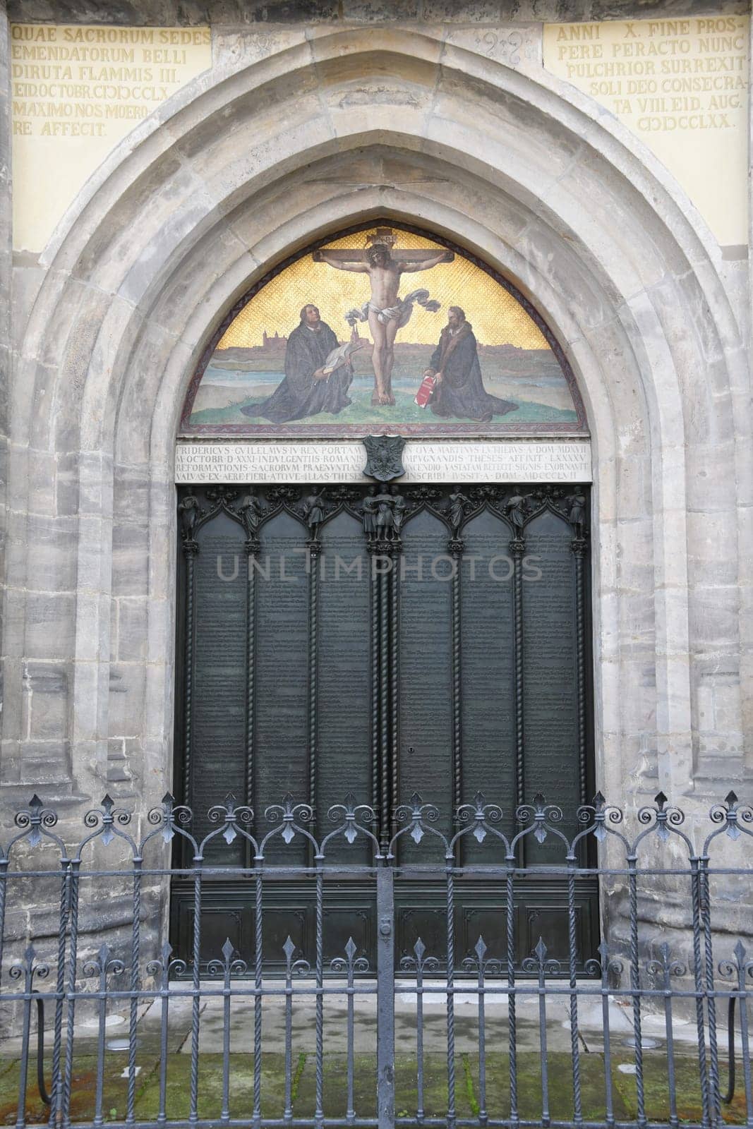 Historical 95 disputation theses of Martin Luther at the thesis door of the castle church in Wittenberg