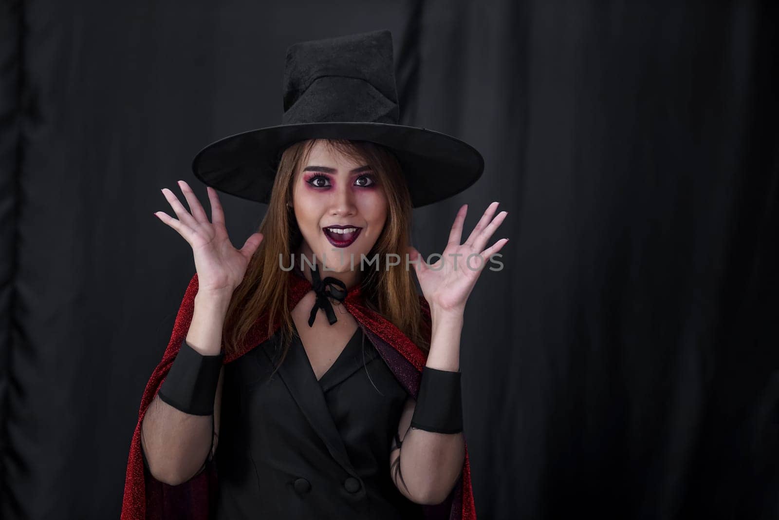 Portrait of asian young adult teenage woman wear Halloween costume cloth for Halloween party carnival. Halloween celebrate and international holiday concept.