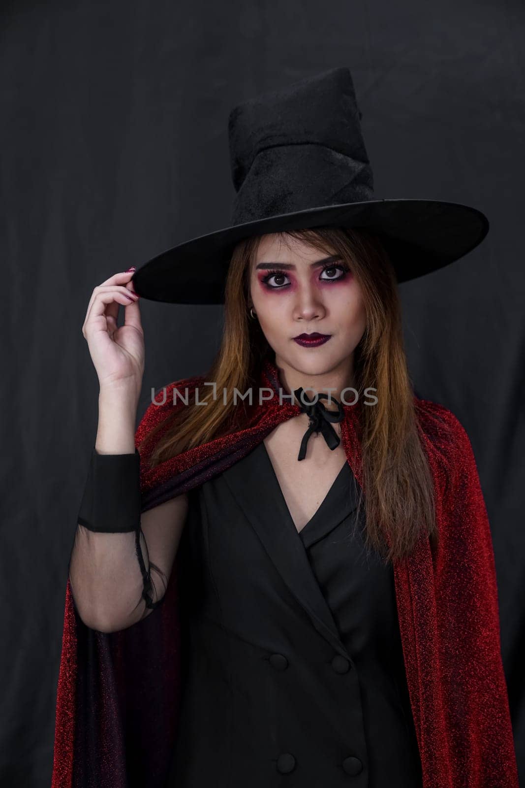 Portrait of asian young adult teenage woman wear Halloween costume cloth for Halloween party carnival. Halloween celebrate and international holiday concept.