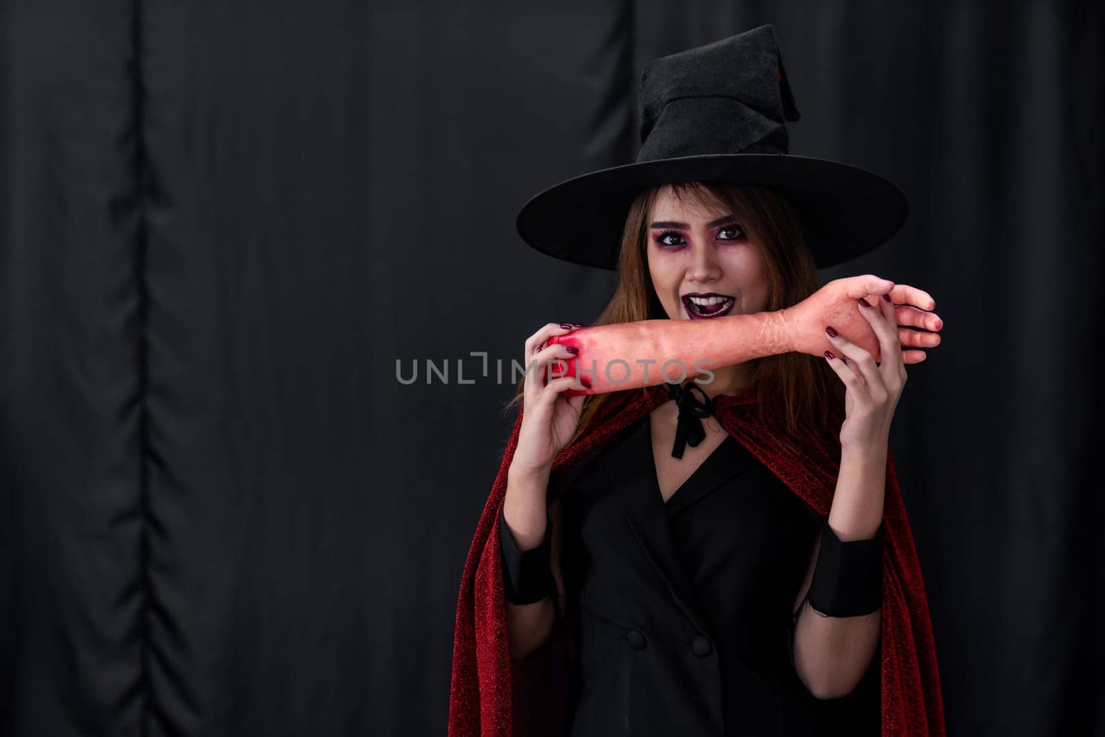 Portrait of asian young adult teenage woman wear Halloween costume cloth for Halloween party carnival. Halloween celebrate and international holiday concept.