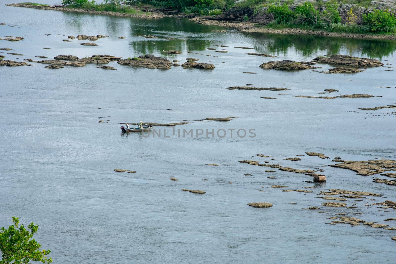 Two Men on a Small Fishing Boat on the Susquehanna River Near Historic Lock 12 in Pennsylvania