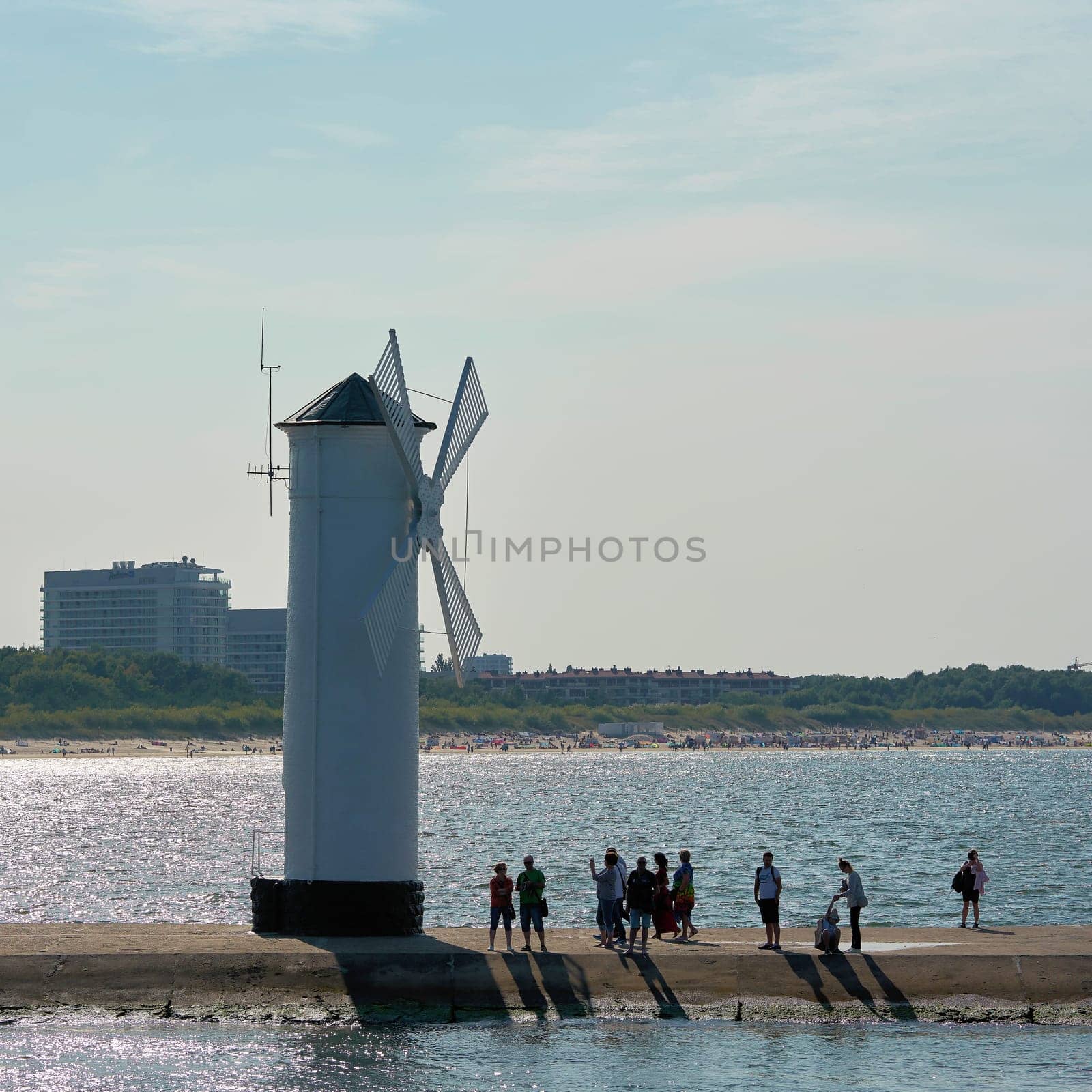 The windmill fire on the shore of the Baltic Sea coast, the symbol of the town of Swinoujscie