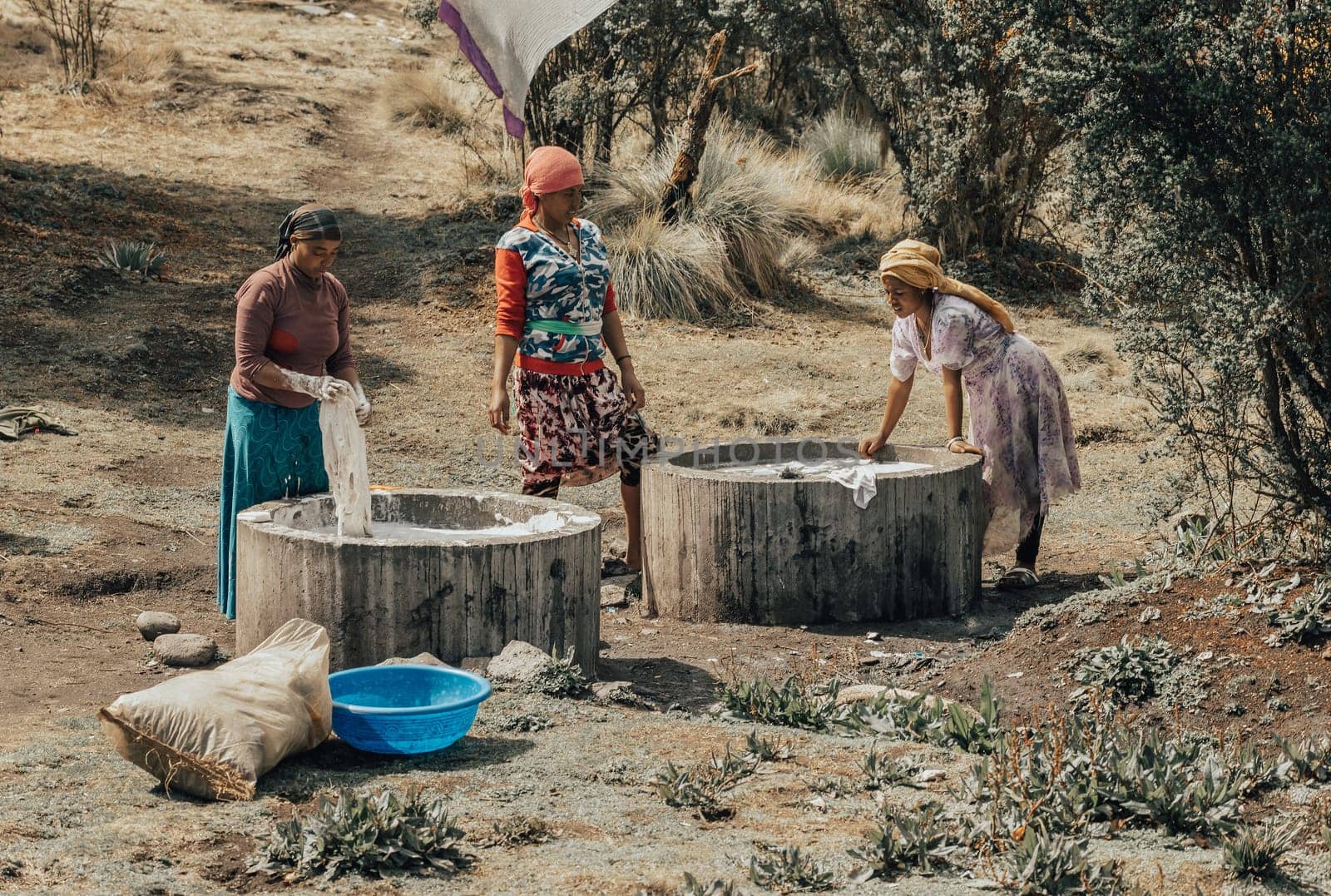 SIMIEN MOUNTAIN, ETHIOPIA, APRIL 25th.2019, Ethiopian women wash clothes in the traditional way outdoors in Simien Mountains, Ethiopia, April 25. 2019