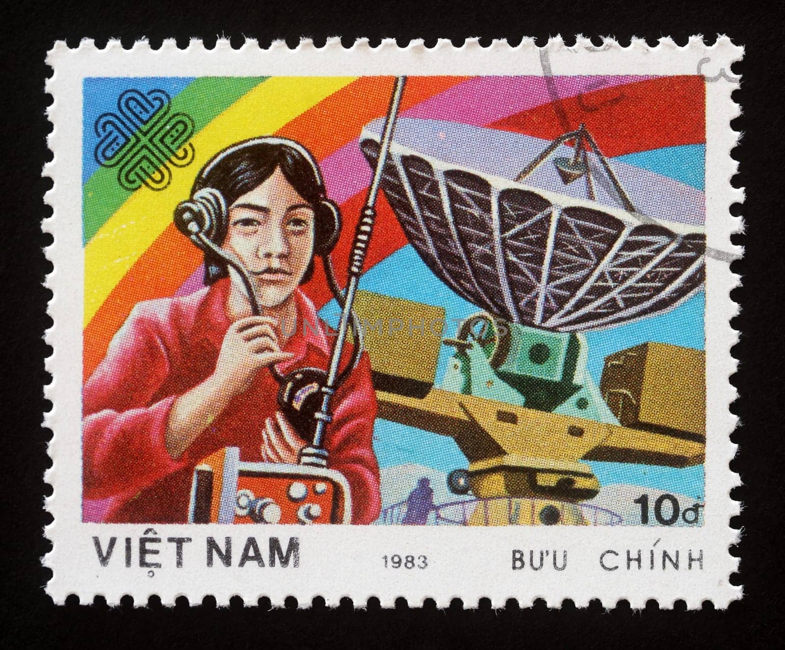 Stamp printed in Vietnam shows Radiooperator and antenna, World Communication Year, circa 1983.
