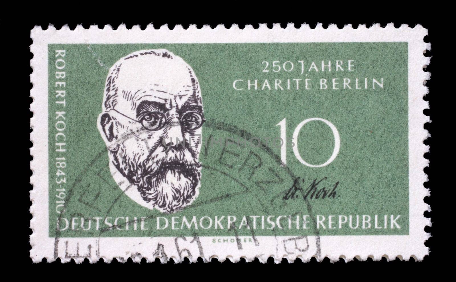Stamp issued in Germany - Democratic Republic (DDR) shows Prof. Dr. Robert Koch, bacteriologist, 125th annivers. of the Humboldt university, 250th annivers. of the Charité, circa 1960.