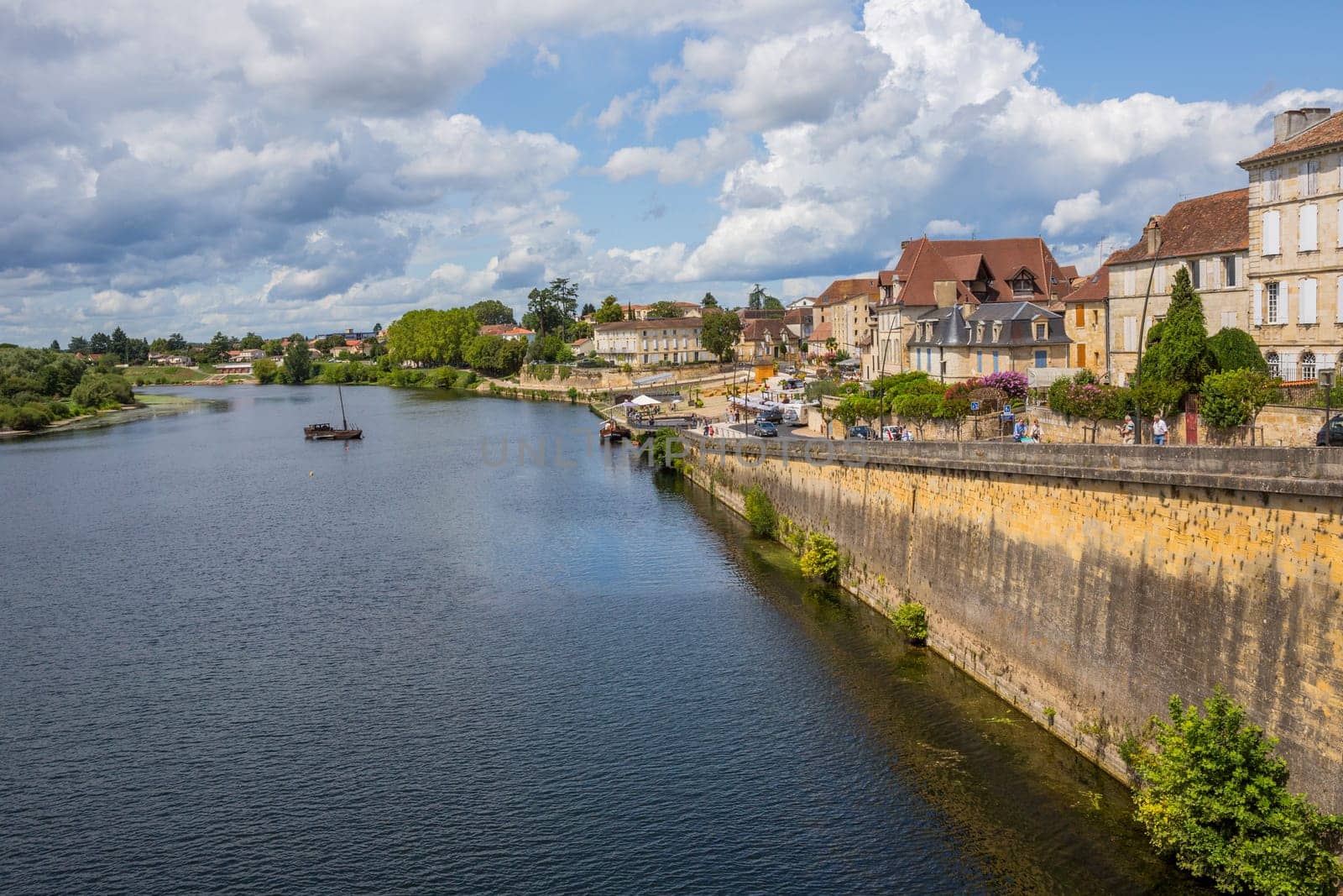 BERGERAC, FRANCE - AUGUST 12, 2019: Dordogne Riverfront in Bergerac. The town has an important tourist industry.