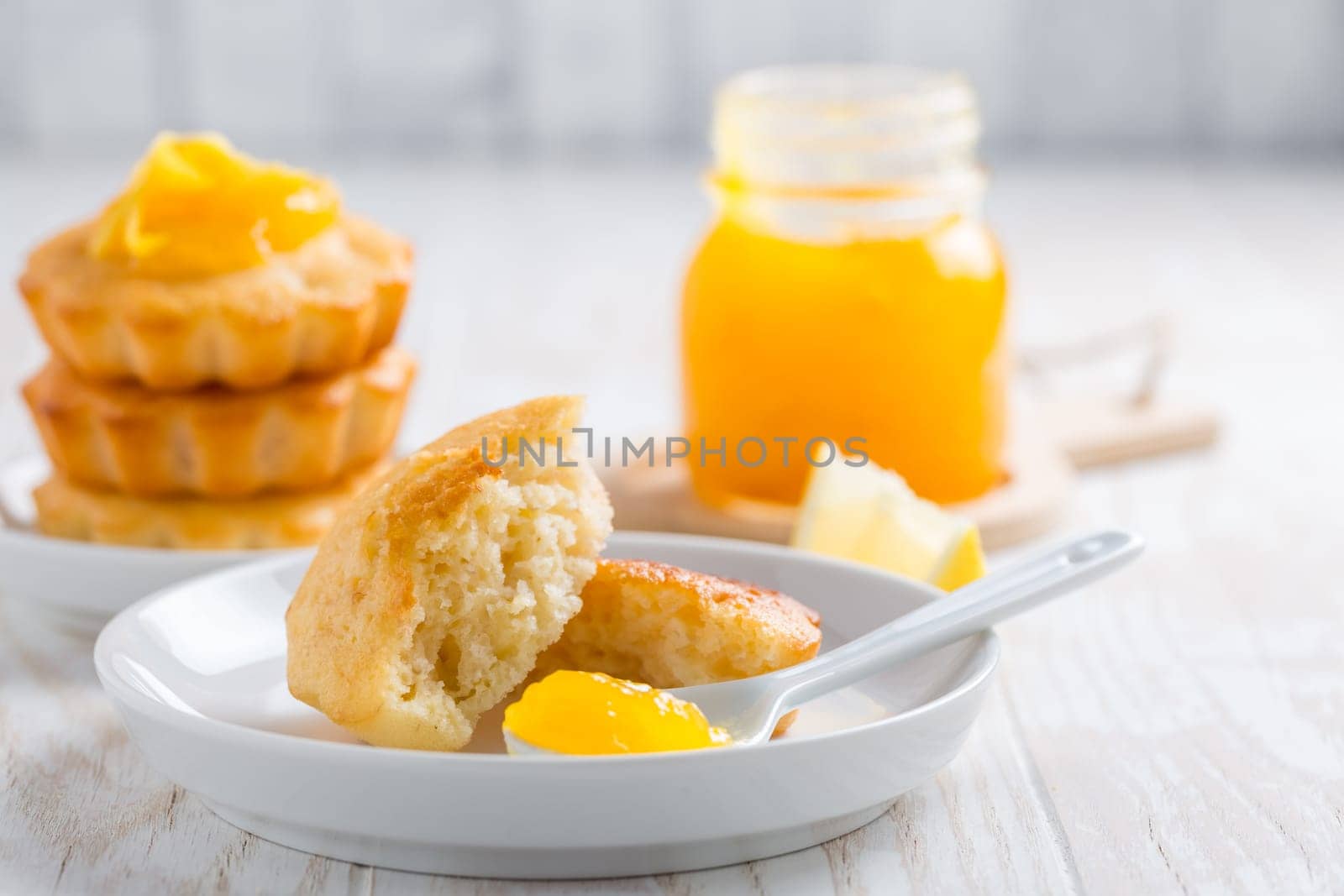 Homemade lemon curd tarts on kitchen table