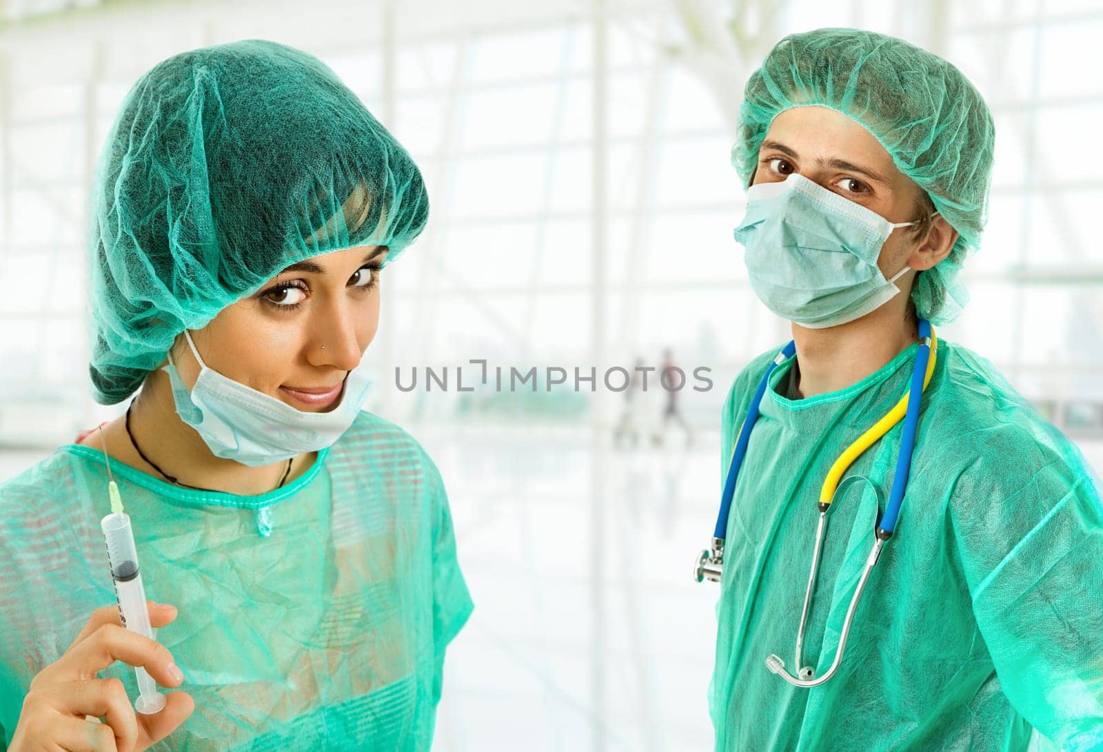 two young doctors, isolated on white background