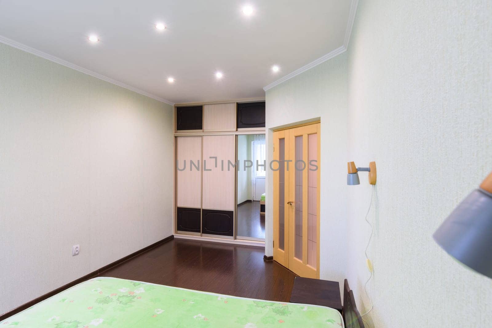 Bedroom interior, large built-in wardrobe, front door